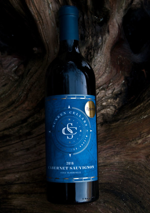 Bottle of Sunken Cellar's cabernet sauvignon reserve on a big log