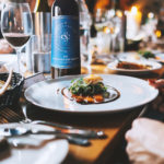 A bottle of 2017 Sunken Cellars Cabernet Sauvignon amidst a meal